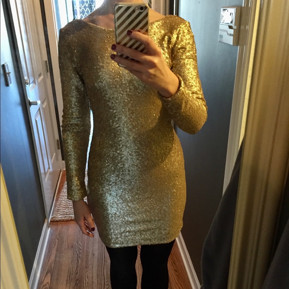 Dress the population M gold sequin mini dress.  Perfect for NYE!